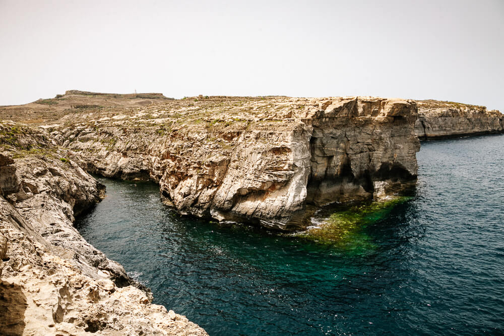 Visiting Wied Il-Ghasri, a gorge that flows into the sea, is one of the best things to do on Gozo.