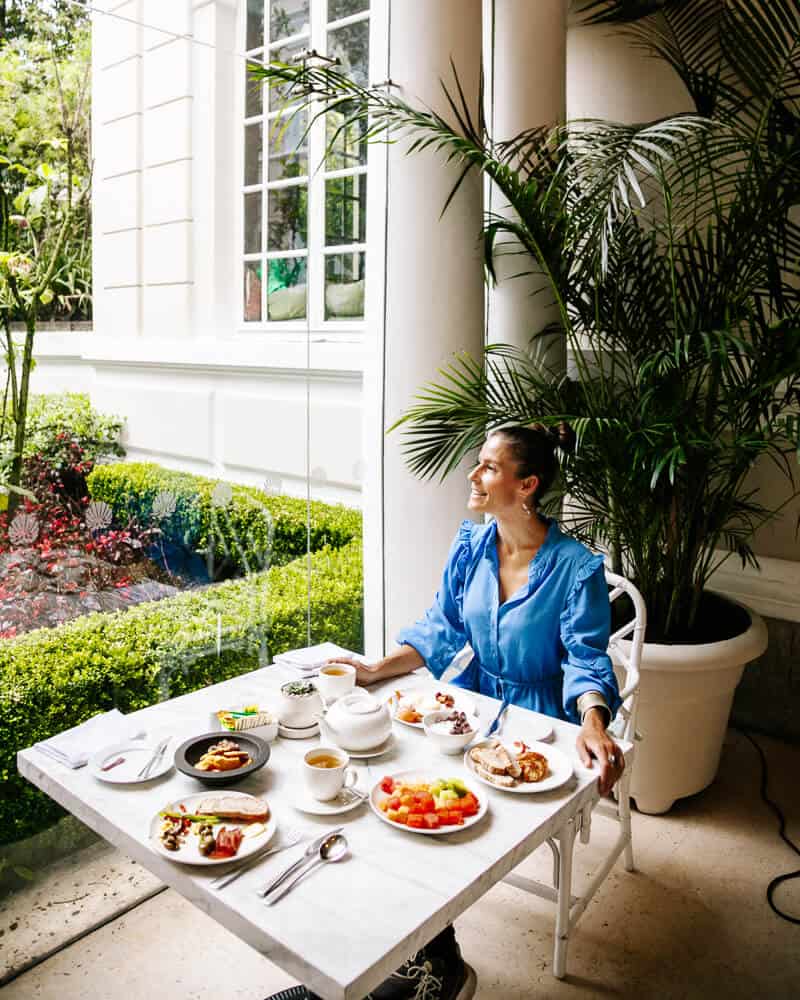 Deborah in garden of Hotel Casa Gangotena in Quito.