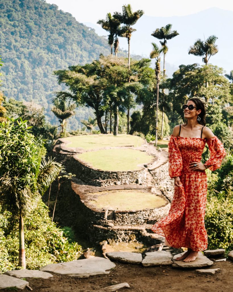 Deborah in orange dress at Lost City in Colombia