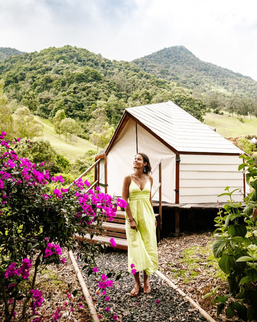 Deborah in front of luxury tent at Glamping Lumbre near Salento and Cocora Valley in Colombia