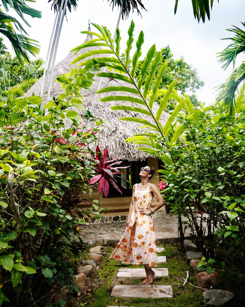 Deborah in front of bungalow at One Love hotel Palomino Colombia 