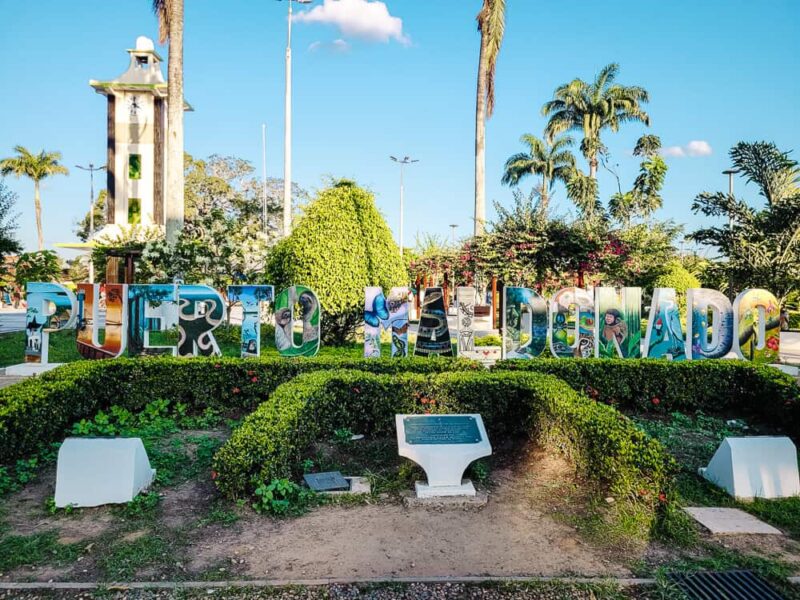 Puerto Maldonado sign at central square.