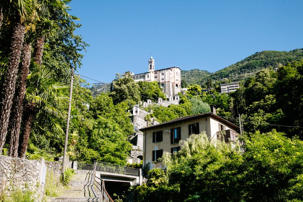 High above the glittering Lake Maggiore, halfway up the mountain, you’ll find the Santo Monte Madonna del Sasso Monastery, located in the municipality of Orsolina. 