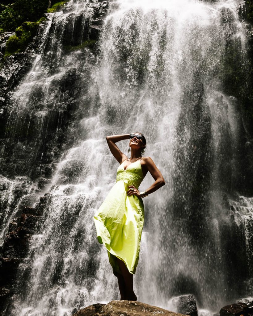 Deborah in front of waterfall of Reserva Natural y Cascada Los Tucanes, one of the best things to do in the surroundings of Villa de Leyva