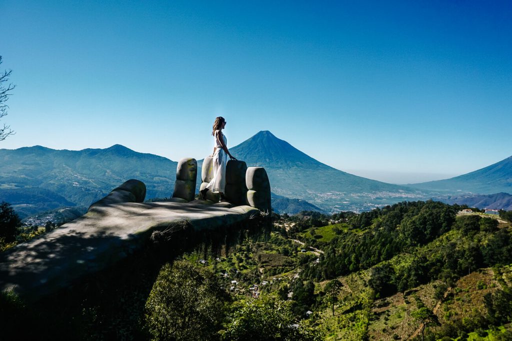 Deborah in hobbithand in Hobbitenango, taking a picture is one of the best things to do around Antigua Guatemala.