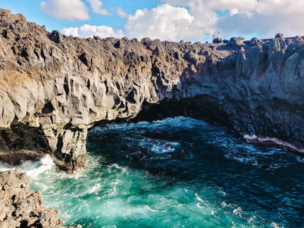 View of los hervideros, a rocky outcrop with holes cut out of the sea