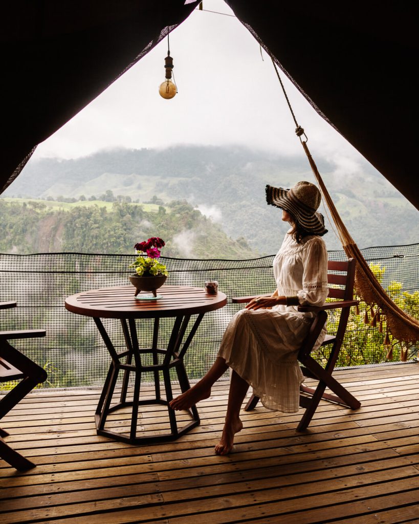 Deborah at balcony El Nido del Condor, one of the best and most unique hotels in Colombia.