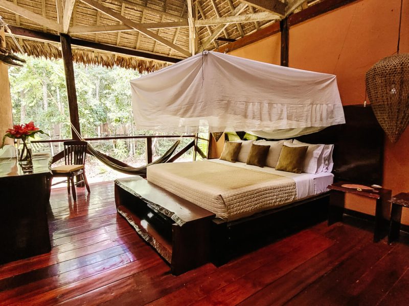 Deluxe room with open side to the jungle and large beds at Refugio Amazonas - jungle lodge Tambopata Peru, by Rainforest Expeditions.