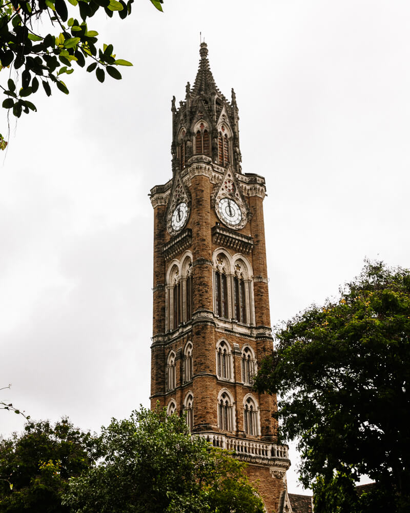 Oval Maiden in Mumbai is surrounded by a clock tower resembling the Big Ben and other stately British-colonial Victorian-style buildings.