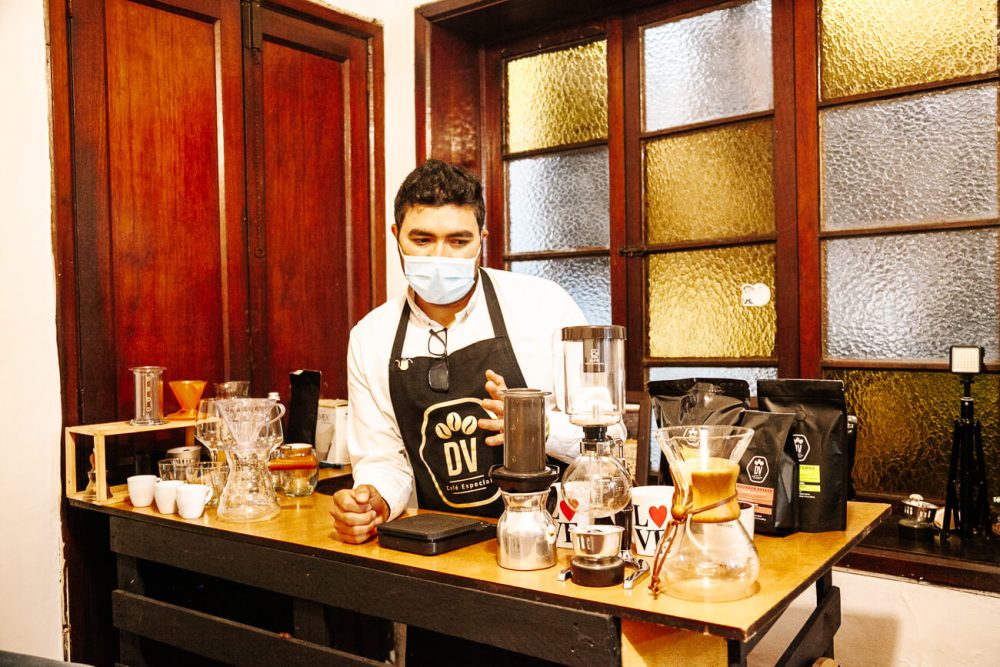 Leandro Galindo Giraldo presents different coffee extraction methods during a coffee tasting in Bogota.