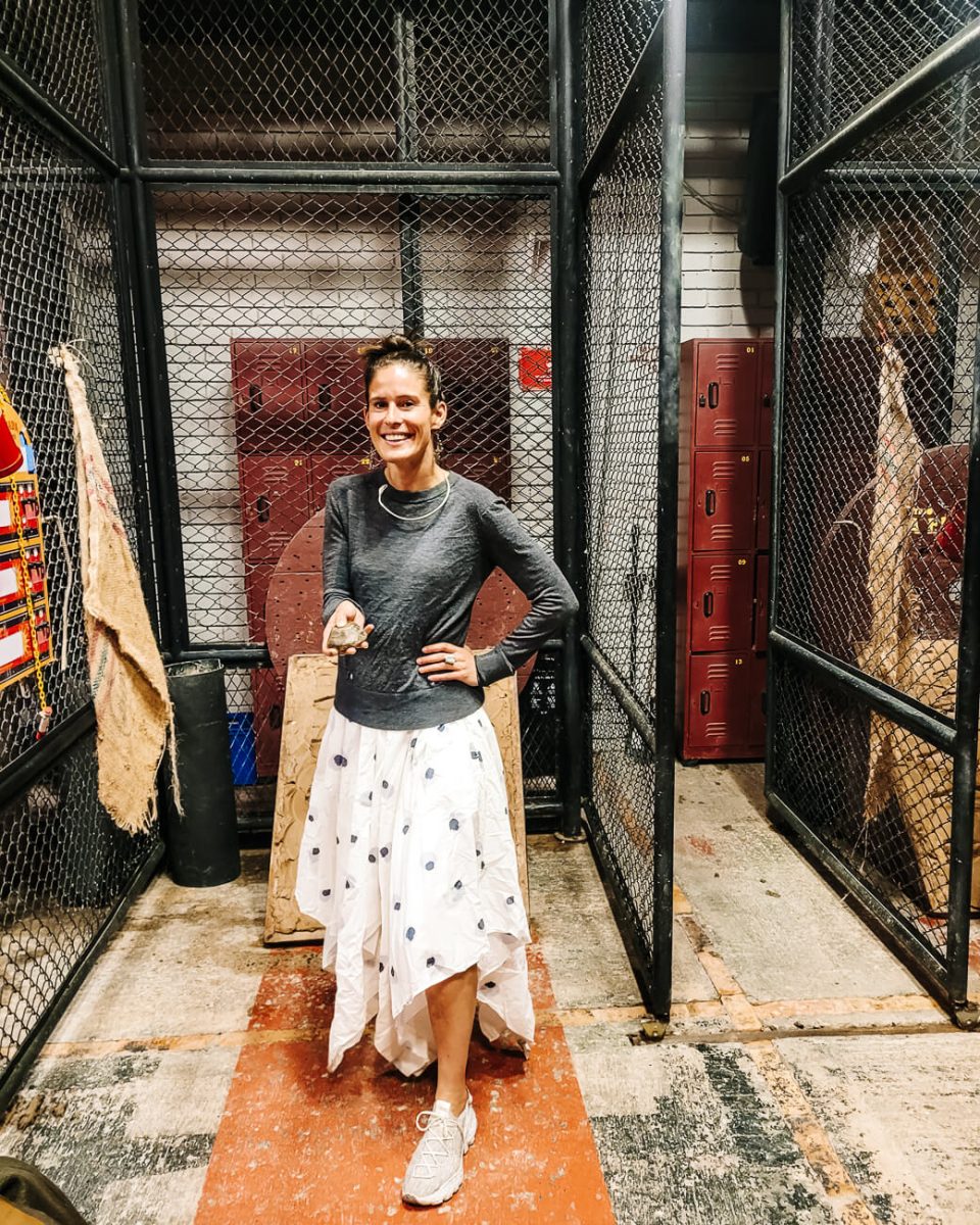 Deborah playing tejo, at Tejo La Embajada, a national sport in Colombia.