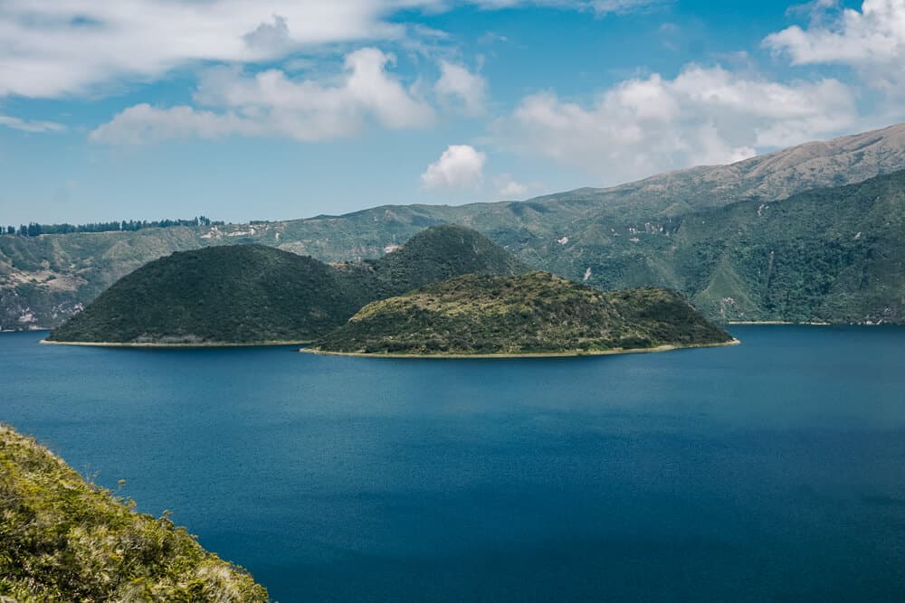 Cuicocha Lake, is a large crater lake, located at the foot of the Cotacachi volcano and one of the things to do in Otavalo in Ecuador.